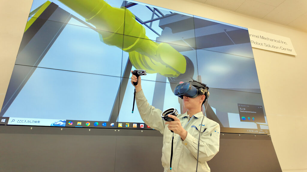 ロボット自動化設備の完成イメージをVRで確認する様子